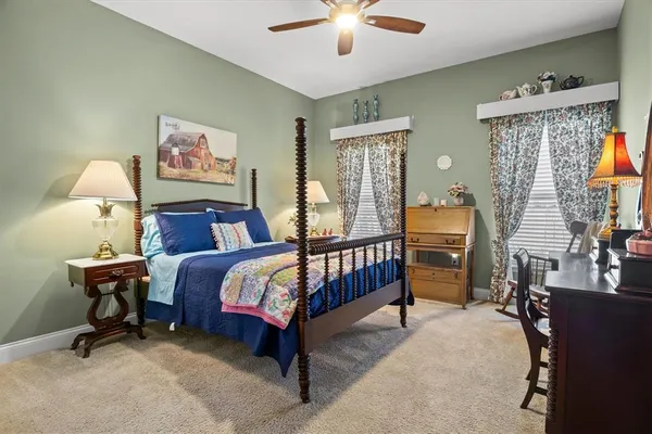 a view of a house with backyard porch and sitting area