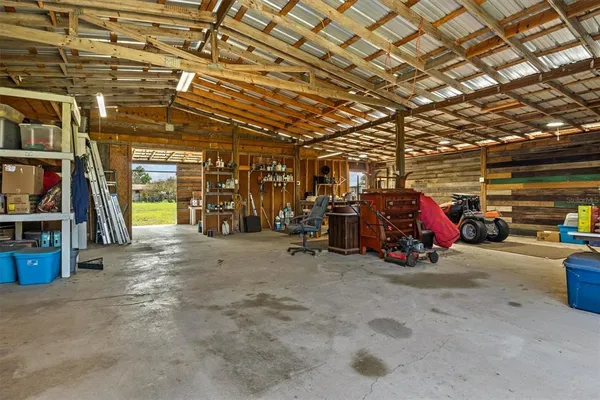 an aerial view of residential houses with outdoor space and lake view