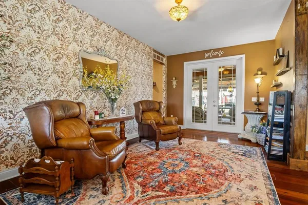 a living room with furniture and a rug
