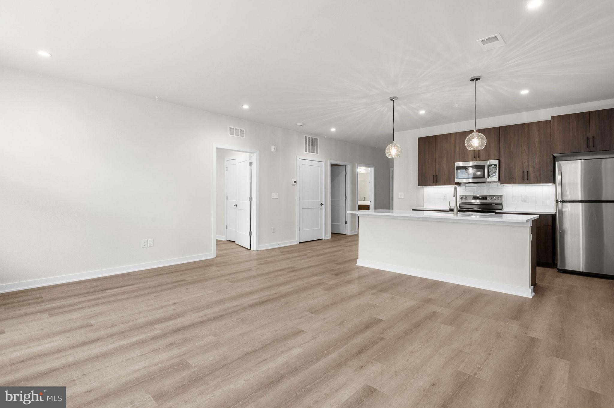 26 South York Road, Unit 308 Hatboro, PA 19040 - Photo 14 of 51 a view of kitchen with wooden floor