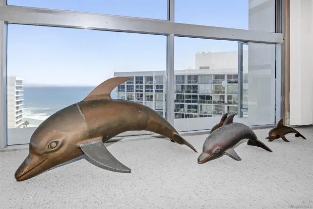 a bed sitting in a bedroom next to a balcony