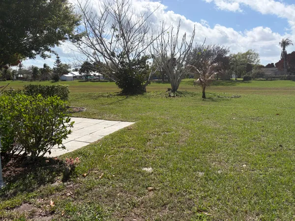 a view of outdoor space with deck and yard