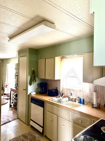 a kitchen with stainless steel appliances granite countertop a sink and cabinets