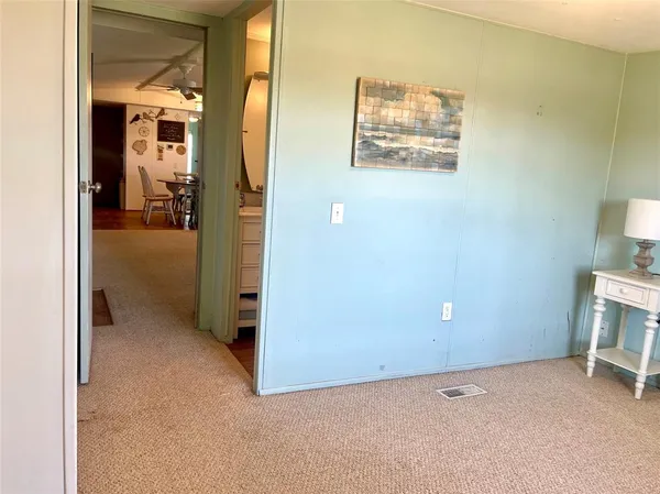 a view of a hallway with closet