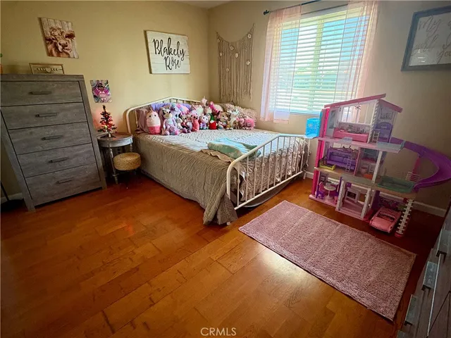 a bedroom with bed and a window