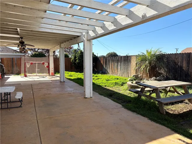 a view of a backyard with sitting area
