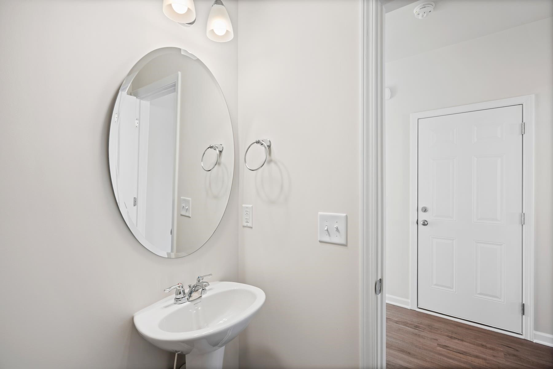 158 Karlov Road Garner, NC 27529 - Photo 23 of 37 a bathroom with a sink and a mirror