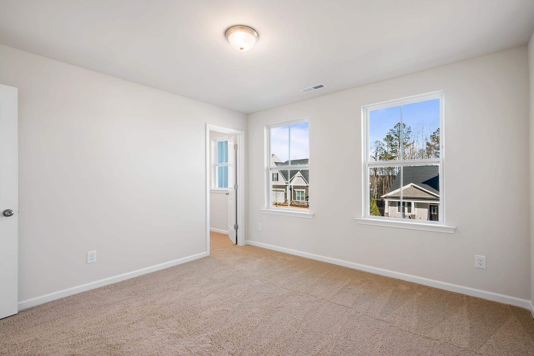 158 Karlov Road Garner, NC 27529 - Photo 26 of 37 an empty room with windows and closet