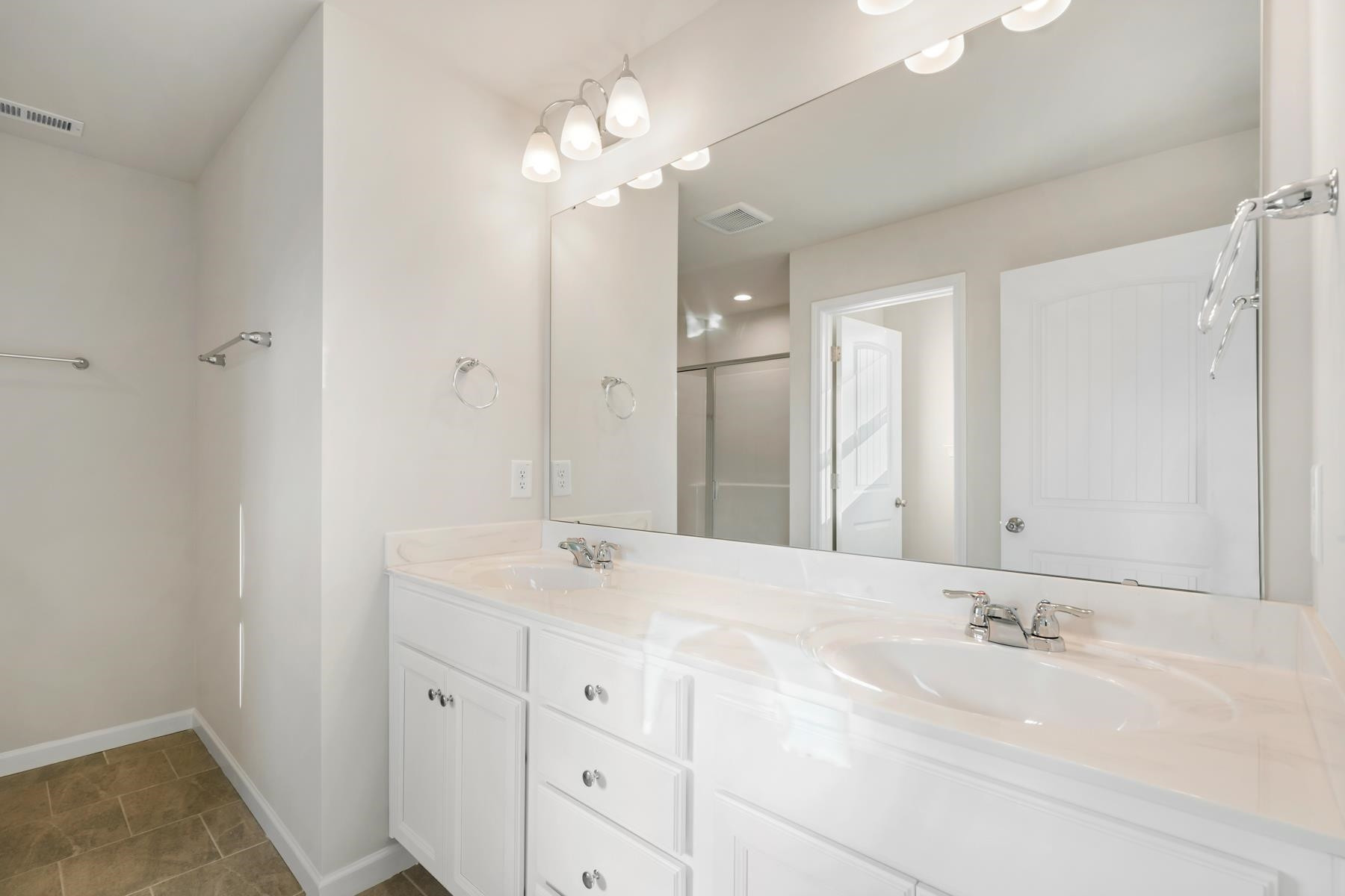 158 Karlov Road Garner, NC 27529 - Photo 34 of 37 a bathroom with a sink and a mirror