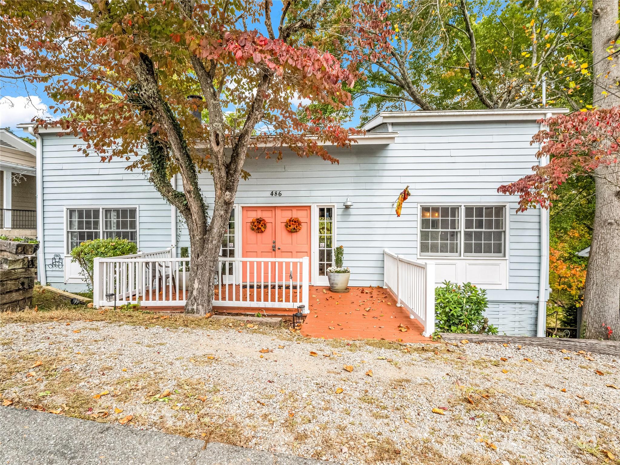 486 Oxford Road Lake Junaluska, NC 28745 - Photo 1 of 35 a front view of a house with a tree