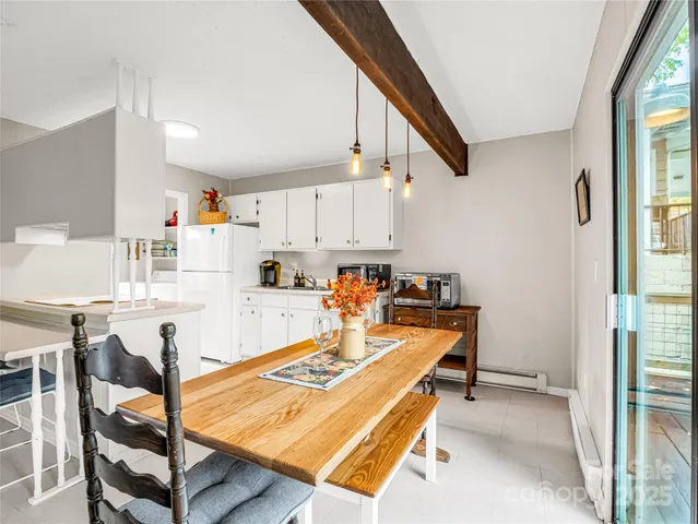 a very nice looking dining room with a table and chairs