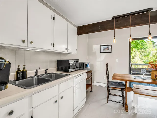 a kitchen with sink cabinets and window