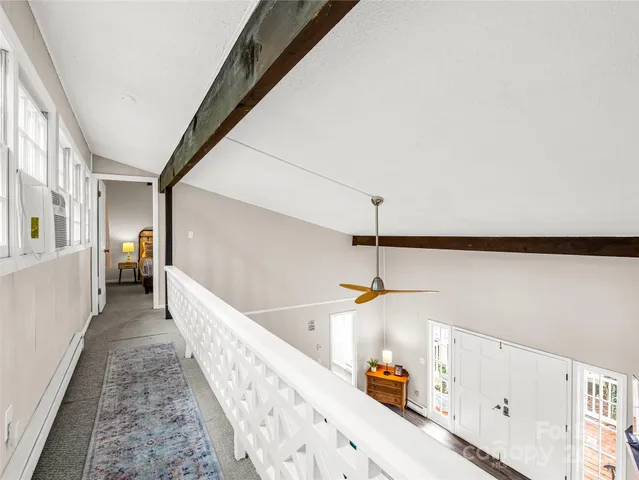 a hallway with a white stove top oven