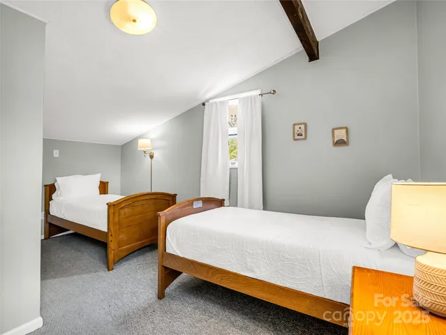 a bedroom with bed and a window