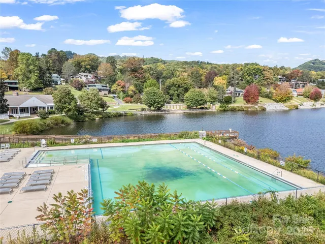 an aerial view of a house with a lake view