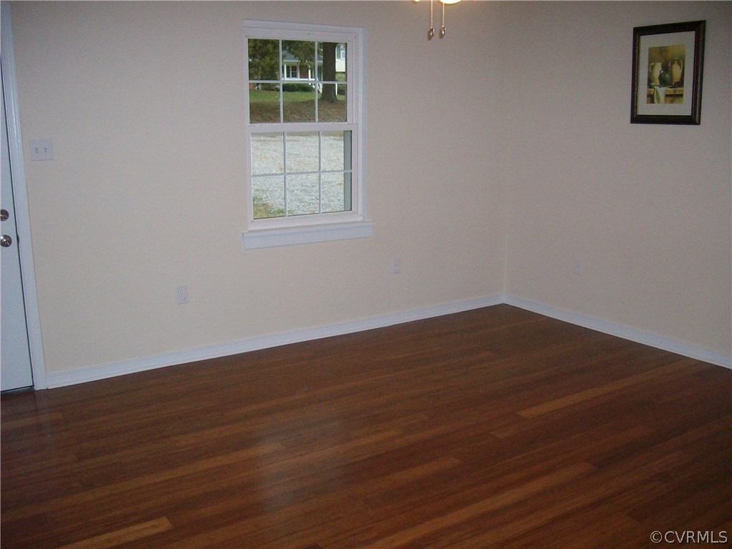 5425 West Hundred Road Chester, VA 23831 - Photo 12 of 14 an empty room with wooden floor and windows