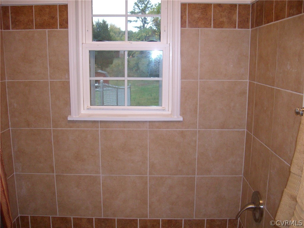 5425 West Hundred Road Chester, VA 23831 - Photo 14 of 14 a bathroom with a shower and a window