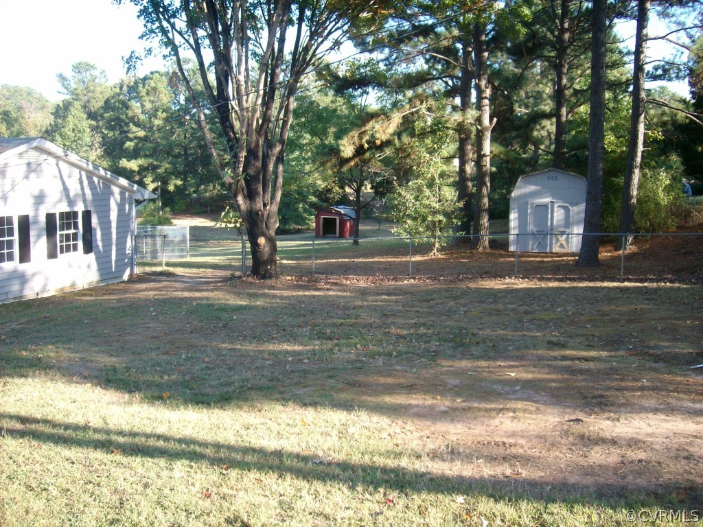 5425 West Hundred Road Chester, VA 23831 - Photo 2 of 14 a front view of a house with a yard