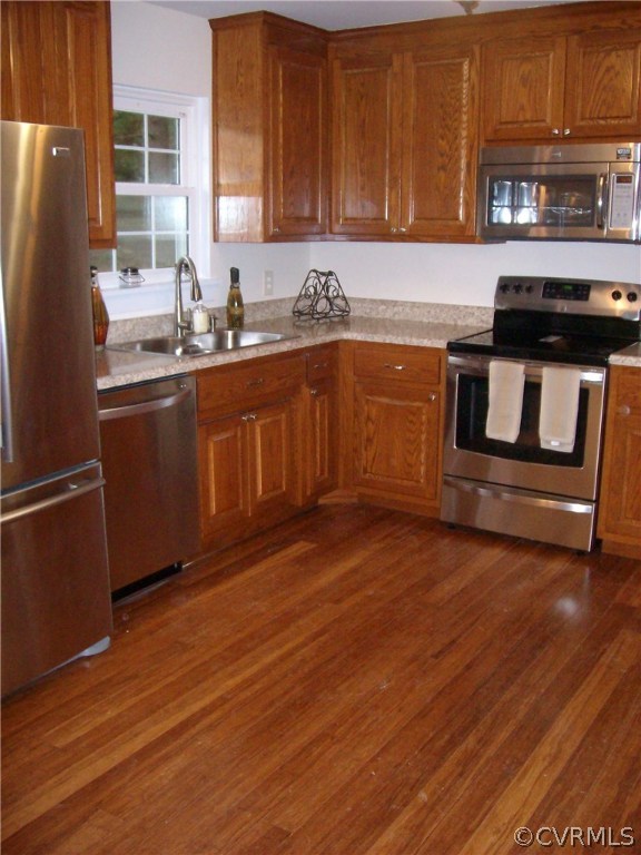 5425 West Hundred Road Chester, VA 23831 - Photo 7 of 14 a kitchen with wooden floors and appliances