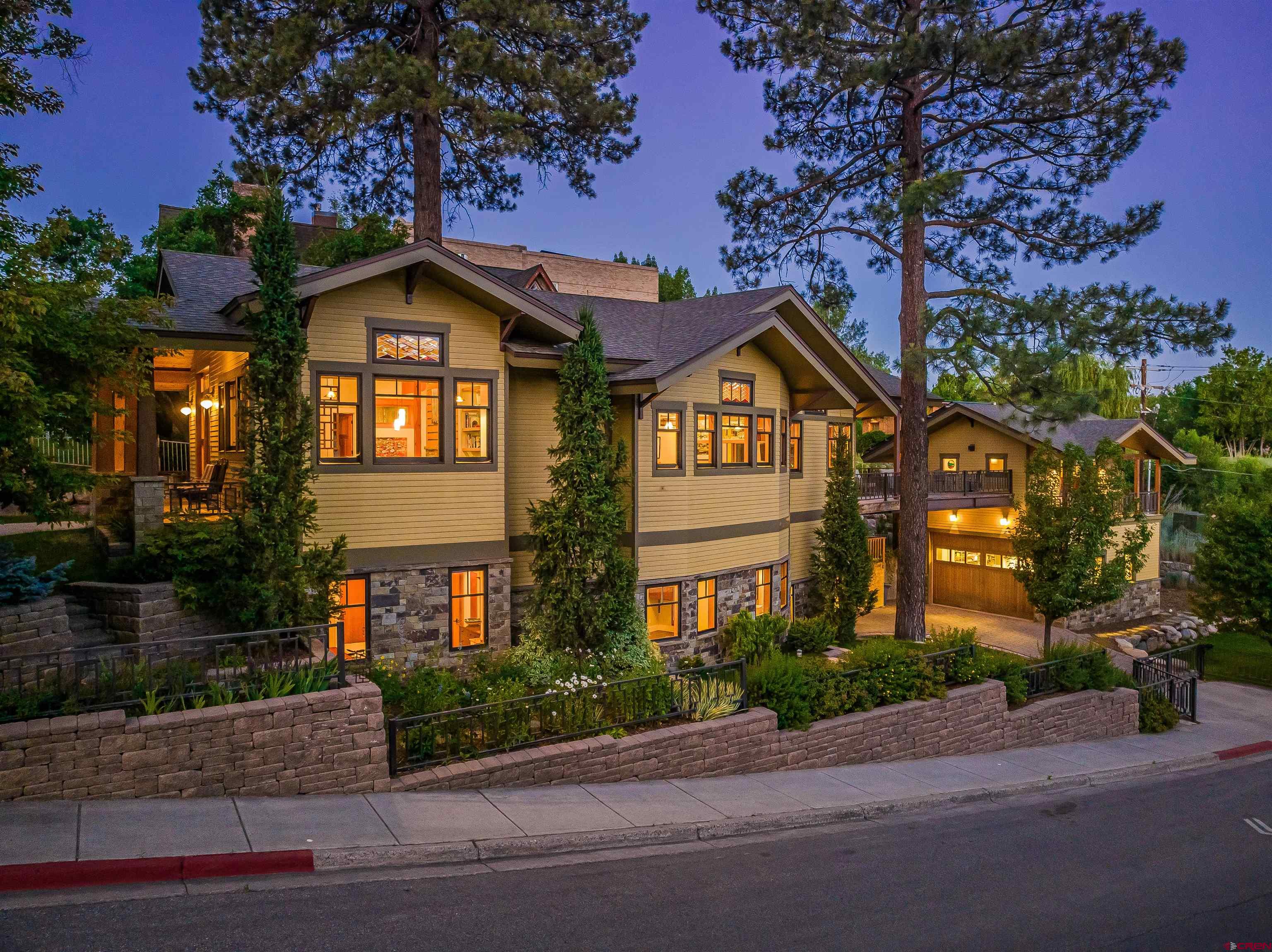 1393 East 3rd Avenue Durango, CO 81301 - Photo 1 of 35 a front view of a house with a yard