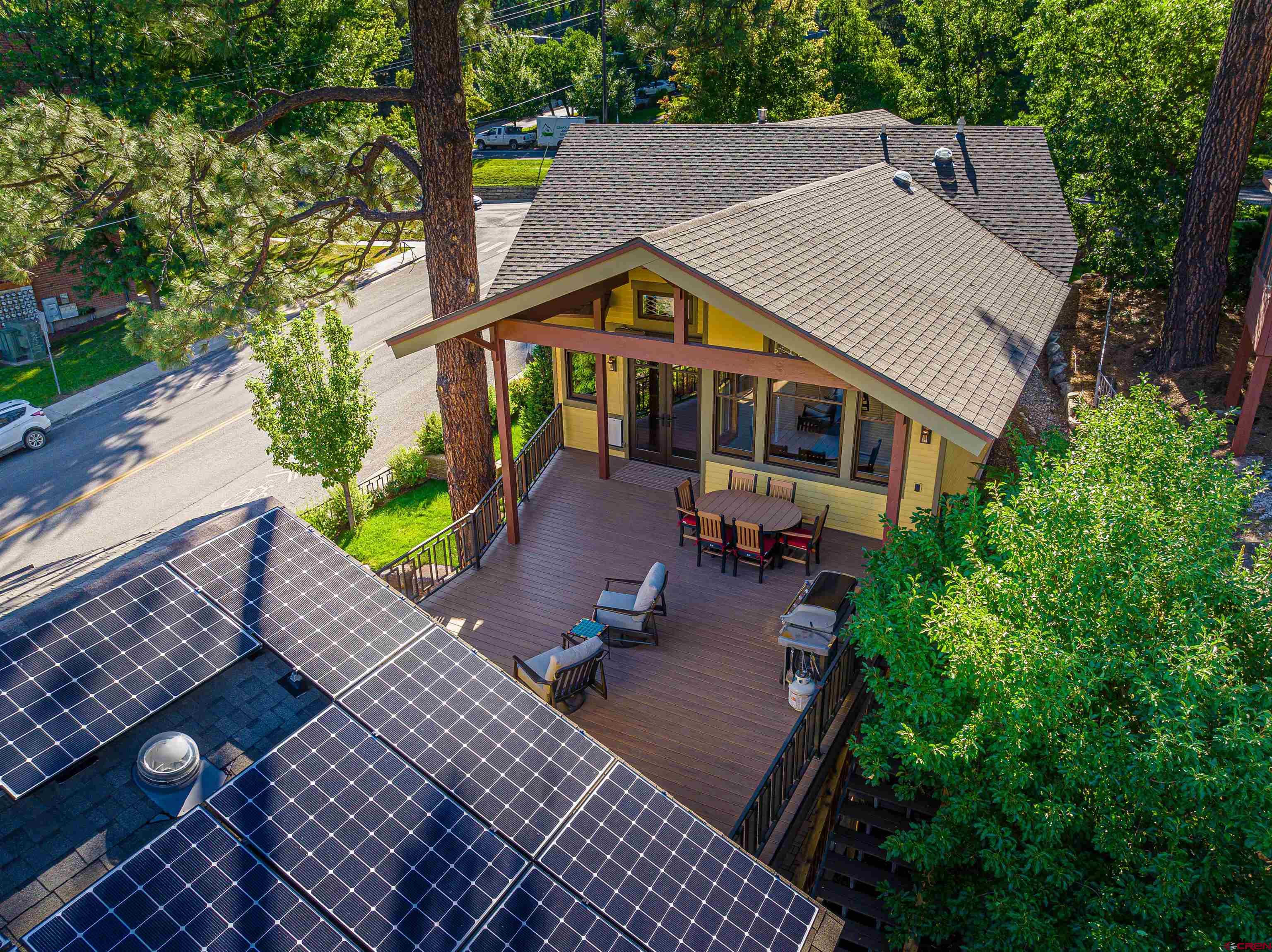 1393 East 3rd Avenue Durango, CO 81301 - Photo 12 of 35 a aerial view of a house with table and chairs in a patio