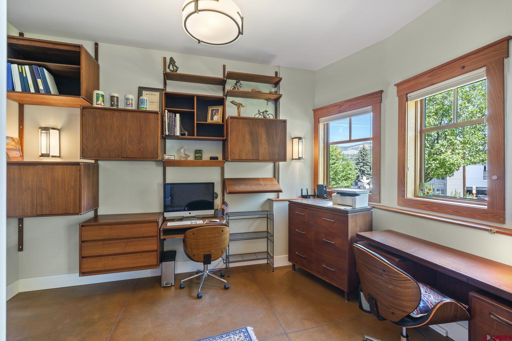 1393 East 3rd Avenue Durango, CO 81301 - Photo 28 of 35 a view of a workspace with furniture and a window