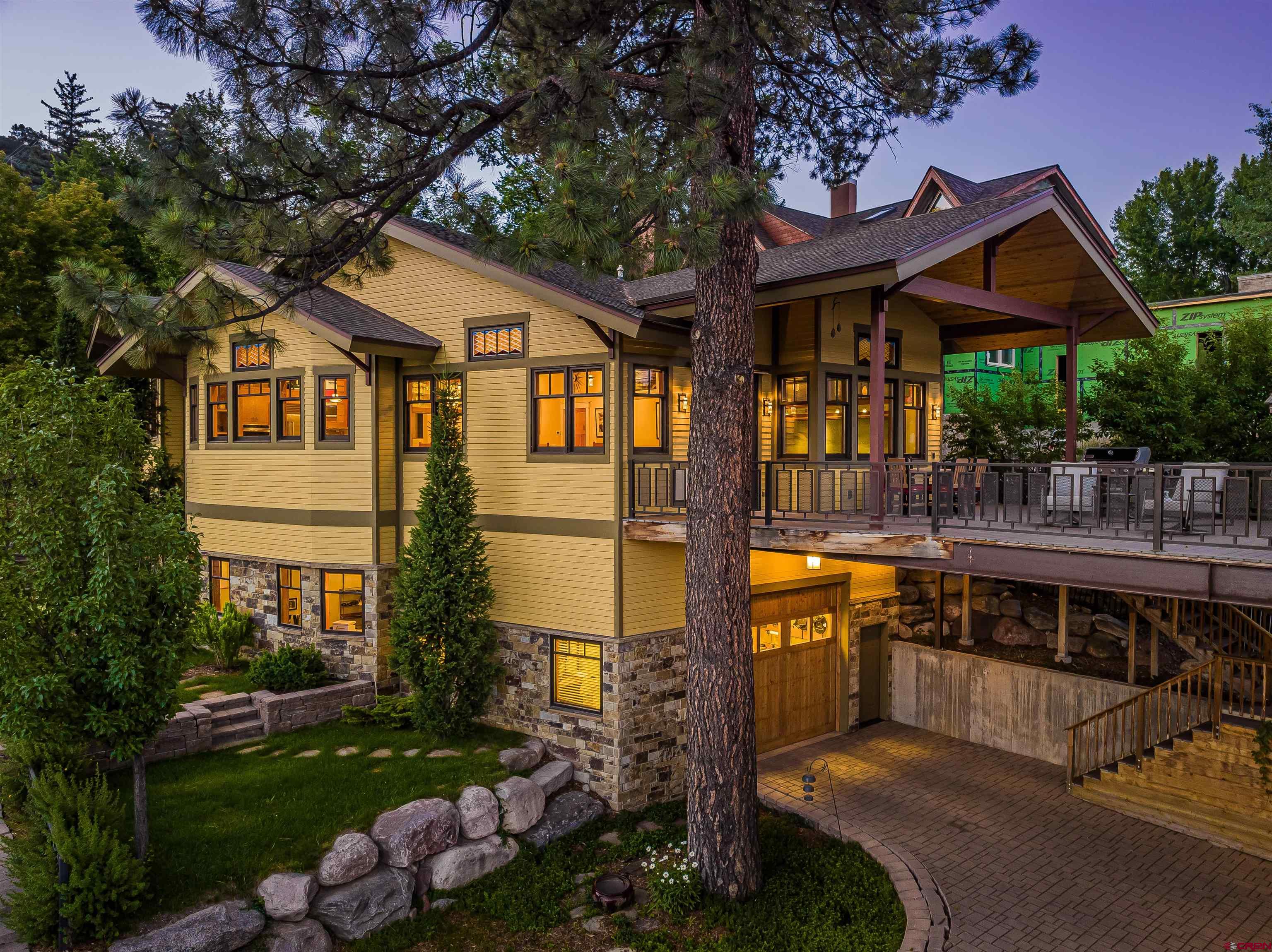 1393 East 3rd Avenue Durango, CO 81301 - Photo 6 of 35 a front view of a house with a yard porch and outdoor seating