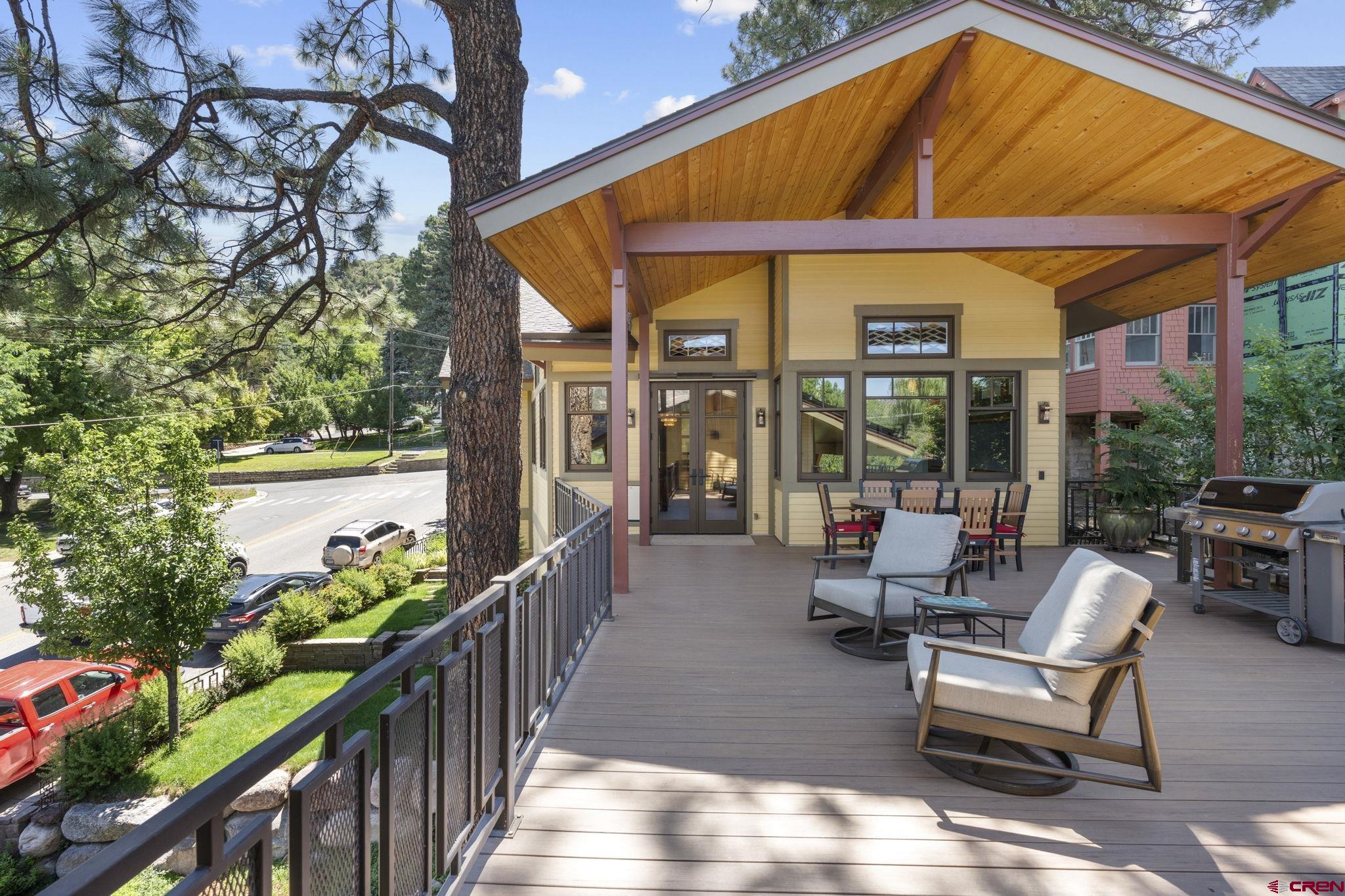 1393 East 3rd Avenue Durango, CO 81301 - Photo 9 of 35 a patio with glass top table and chairs