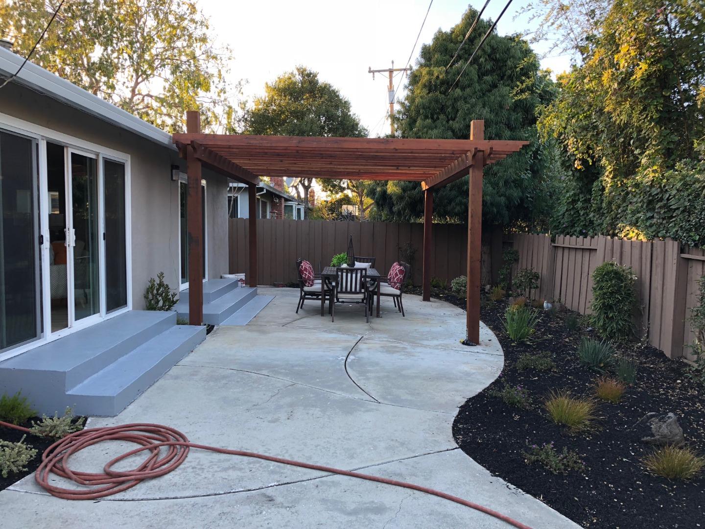 838 Tulane Drive Mountain View, CA 94040 - Photo 19 of 20 a backyard of a house with yard table and chairs