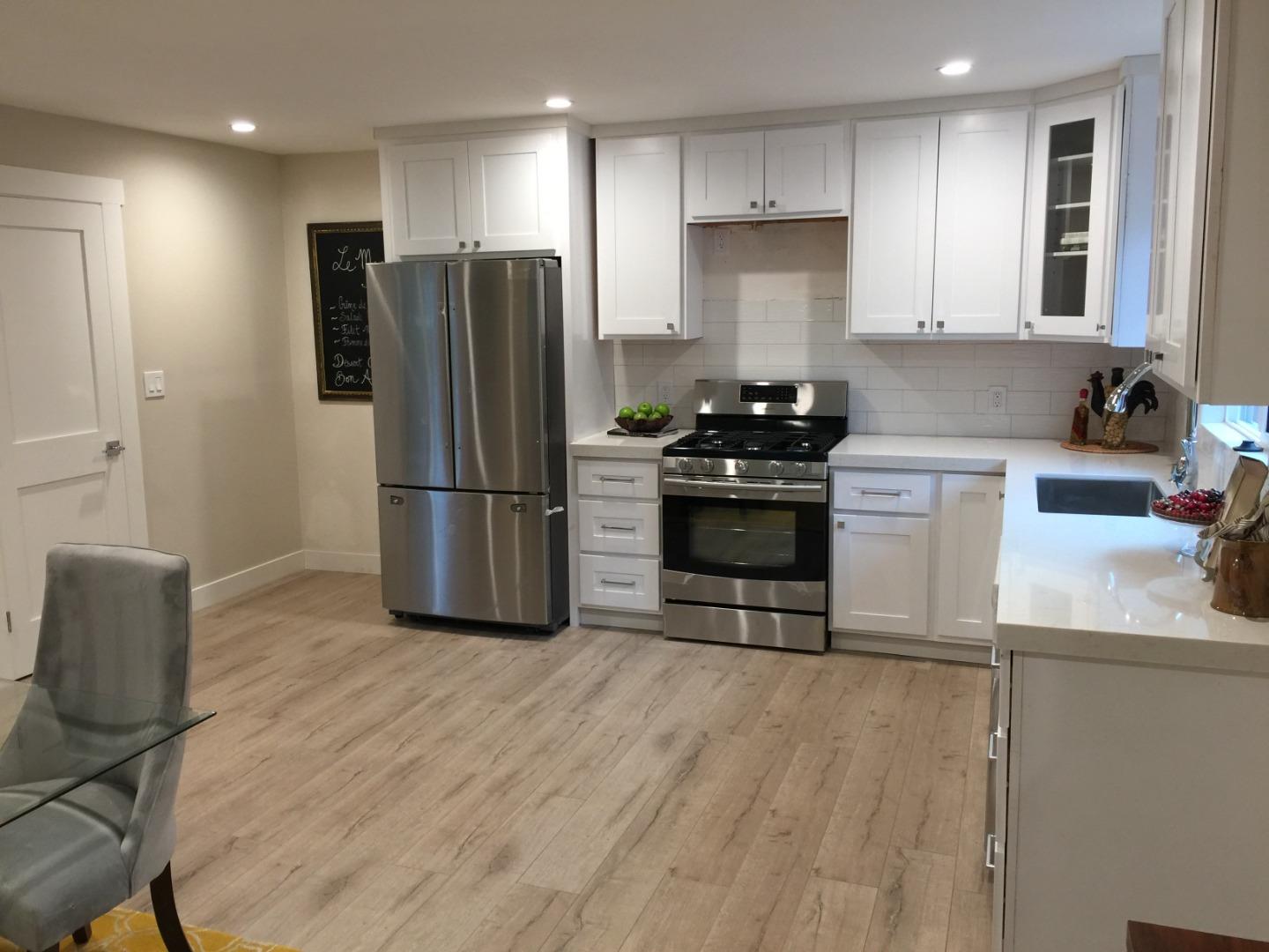 838 Tulane Drive Mountain View, CA 94040 - Photo 6 of 20 a kitchen with granite countertop a refrigerator and a stove top oven