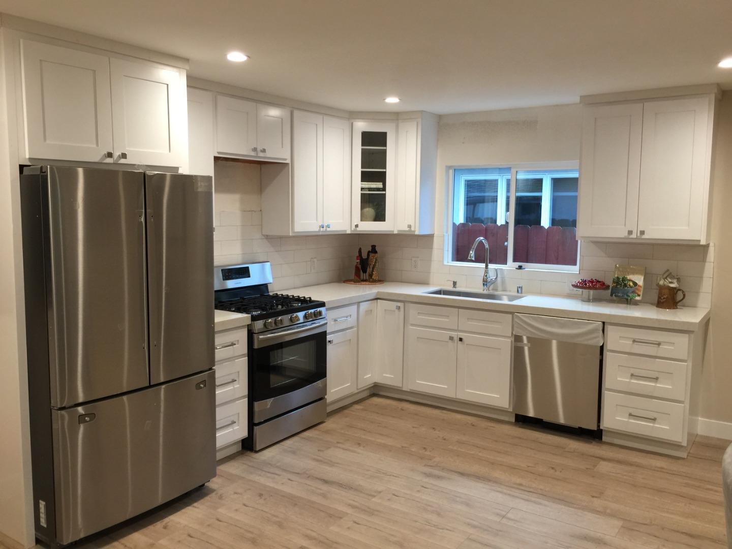 838 Tulane Drive Mountain View, CA 94040 - Photo 7 of 20 a kitchen with a refrigerator stove and sink
