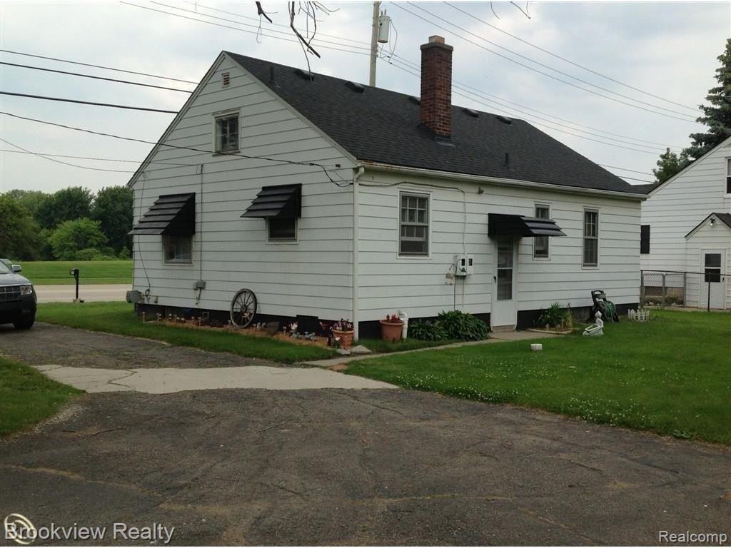 46770 Romeo Plank Road Macomb, MI 48044 - Photo 14 of 19 rear