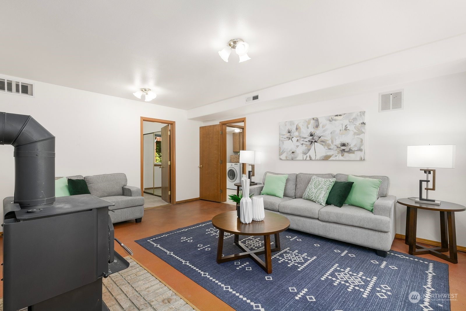 19410 34th Drive Southeast Bothell, WA 98012 - Photo 18 of 25 a living room with furniture a rug and a lamp