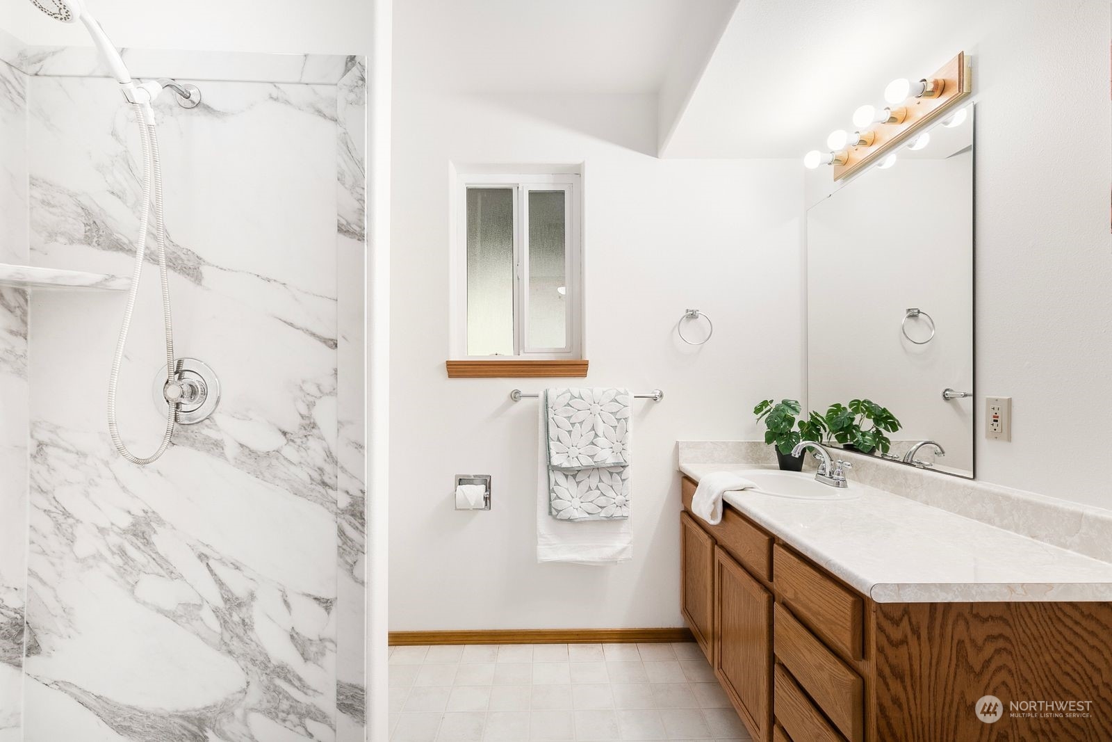 19410 34th Drive Southeast Bothell, WA 98012 - Photo 20 of 25 a bathroom with a bathtub sink and mirror