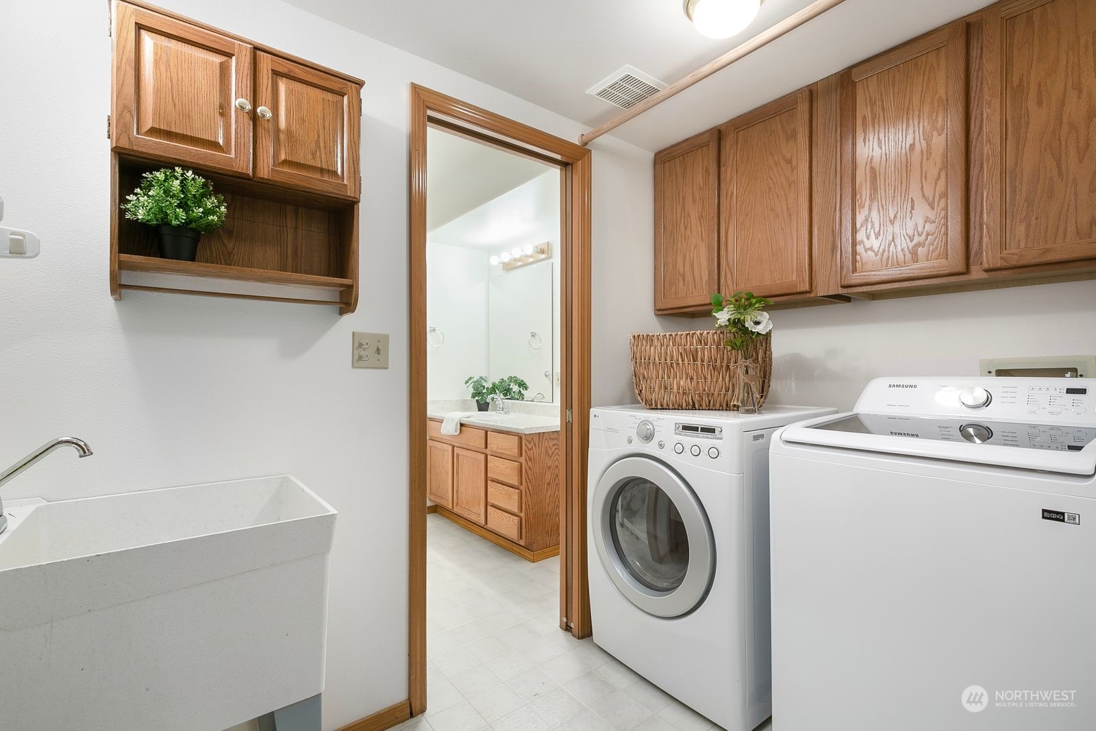 19410 34th Drive Southeast Bothell, WA 98012 - Photo 22 of 25 a utility room with sink dryer and washer
