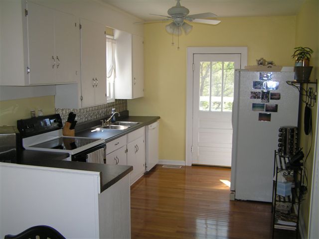 138 Webster Heights Road Roanoke, VA 24012 - Photo 5 of 14 a kitchen that has a sink and a stove