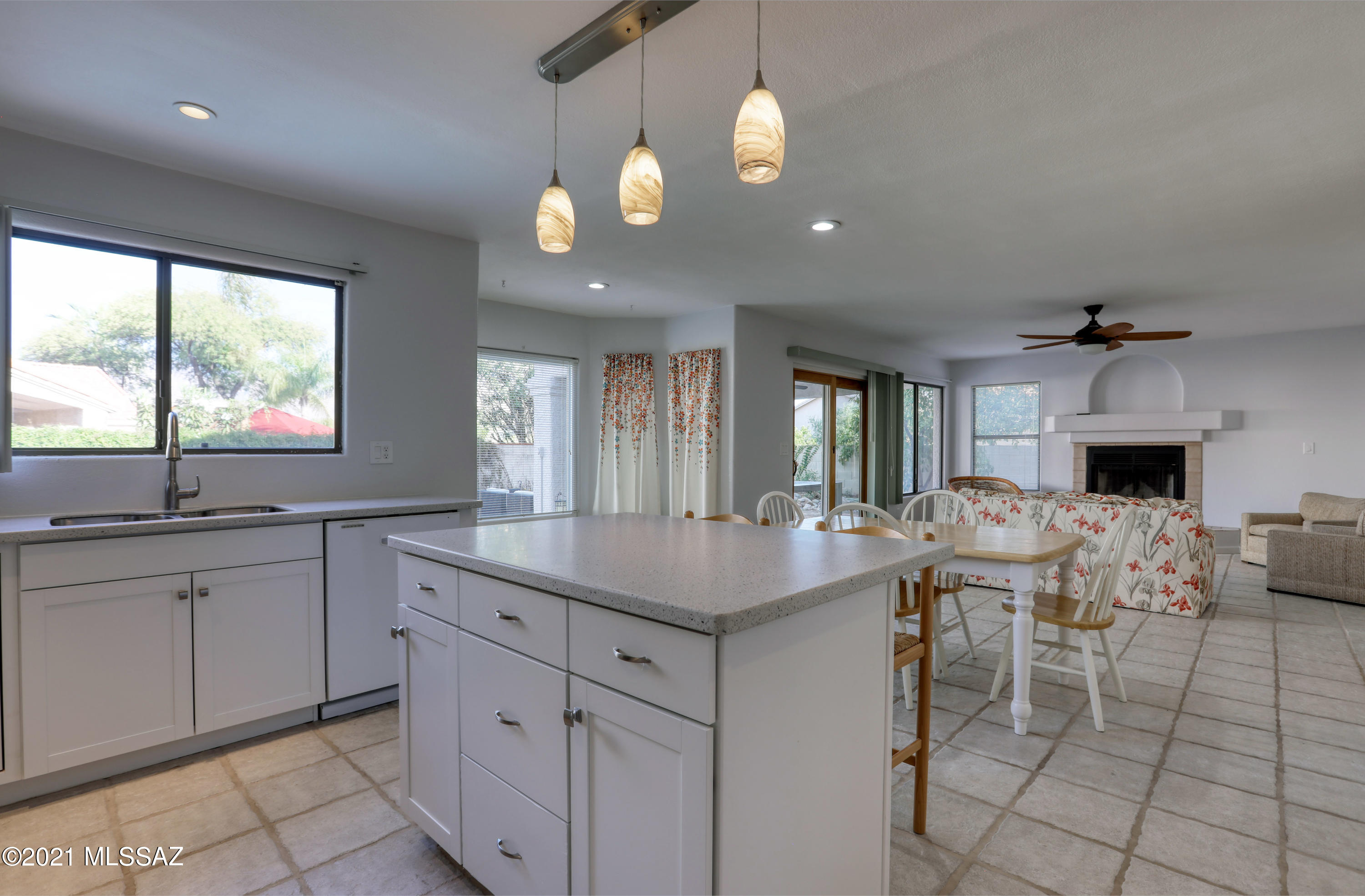 12560 North Wayfarer Way Oro Valley, AZ 85755 - Photo 9 of 43 a kitchen with cabinets and window
