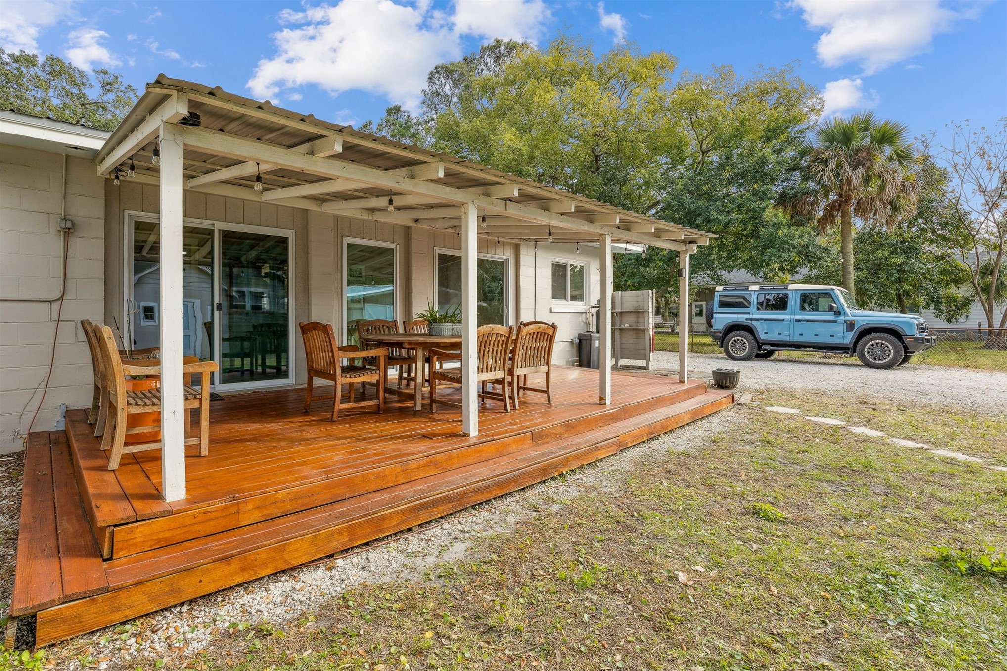 411 South 5th Street Fernandina Beach, FL 32034 - Photo 24 of 43 a view of a house with backyard porch and sitting area