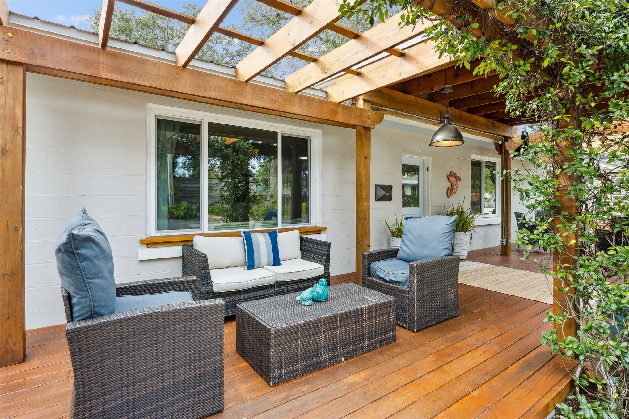 411 South 5th Street Fernandina Beach, FL 32034 - Photo 5 of 43 a outdoor space with patio the couches and a dining table and chairs with wooden floor