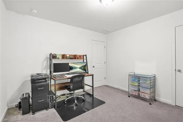 a view of a workspace with furniture