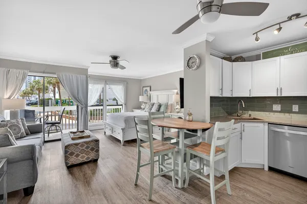 a view of a dining room with furniture window and wooden floor
