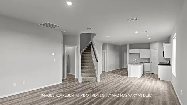 a view of a living room and wooden floor