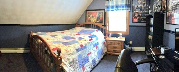 673 Old Petersham Road Barre, MA 01005 - Photo 11 of 19 a bedroom with a bed and a chandelier