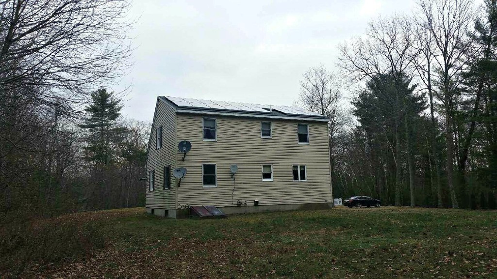 673 Old Petersham Road Barre, MA 01005 - Photo 17 of 19 a view of a house with backyard and garden