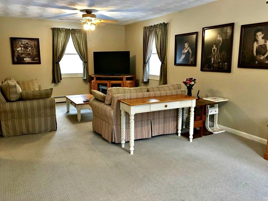 673 Old Petersham Road Barre, MA 01005 - Photo 7 of 19 a living room with furniture and a flat screen tv