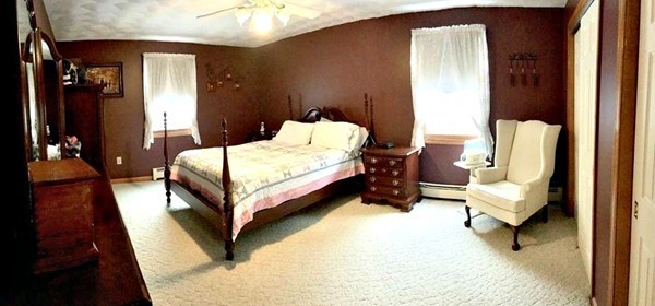 673 Old Petersham Road Barre, MA 01005 - Photo 10 of 19 a bed room with a bed and a chair