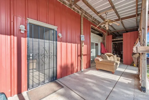 a outdoor space with balcony a couch and chairs