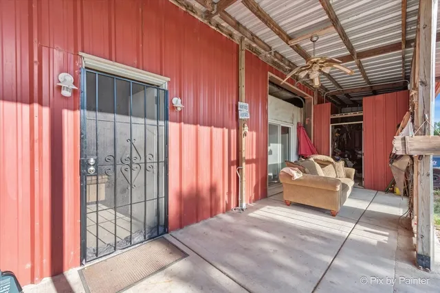 a outdoor space with balcony a couch and chairs