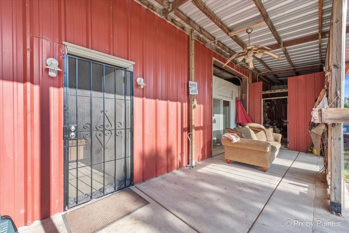 a outdoor space with balcony a couch and chairs