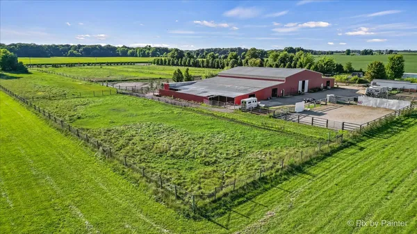 an aerial view of a house with outdoor space